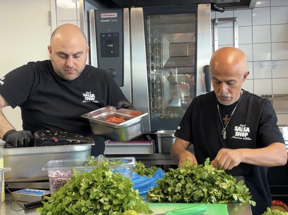 Alex and Lole in the kitchen at Salsa Shop Amsterdam Central Station testing out new recipes.