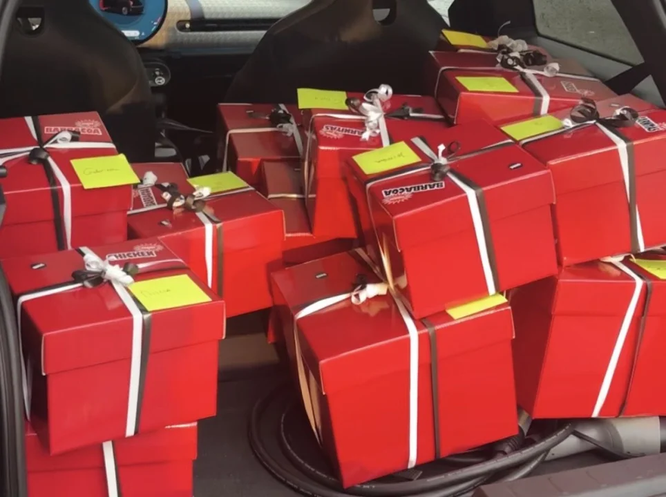 Car trunk filled with Salsa Shop gift packages prepared for influencers, showing branded boxes ready for personal delivery as part of the Salsa Shop creator community.
